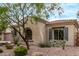 Close-up view of the front exterior, showcasing desert landscaping and architectural details at 12906 W Oyer Ln, Peoria, AZ 85383
