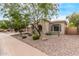 Charming single-story home with desert landscaping and a well-maintained front yard at 12906 W Oyer Ln, Peoria, AZ 85383