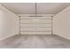 Clean, spacious two-car garage with a sealed concrete floor at 12906 W Oyer Ln, Peoria, AZ 85383