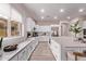 Stunning kitchen with white cabinets, a large island, stainless appliances, and wood-look flooring at 12906 W Oyer Ln, Peoria, AZ 85383