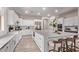 Bright, spacious kitchen featuring white cabinets, a large center island, and stainless steel appliances at 12906 W Oyer Ln, Peoria, AZ 85383