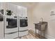 Laundry room featuring washer/dryer, utility sink, and storage at 12906 W Oyer Ln, Peoria, AZ 85383