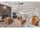 Open living space featuring a modern fireplace, and views of the stylish kitchen at 12906 W Oyer Ln, Peoria, AZ 85383