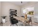 Well-lit home office featuring a modern desk, stylish chairs, and contemporary decor at 12906 W Oyer Ln, Peoria, AZ 85383