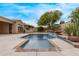 Refreshing pool and spa with built-in tile and desert landscaping at 12906 W Oyer Ln, Peoria, AZ 85383