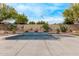 Inviting swimming pool and spa area surrounded by desert landscaping at 12906 W Oyer Ln, Peoria, AZ 85383