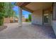 An outdoor patio area with built-in grill and views of the landscaped backyard at 134 E Bernie Ln, Gilbert, AZ 85295
