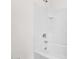 Bright bathroom features a clean, white tiled tub and shower with modern fixtures at 134 E Bernie Ln, Gilbert, AZ 85295