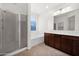 Well-lit bathroom features double sinks, a separate shower, and a tub for relaxation at 134 E Bernie Ln, Gilbert, AZ 85295