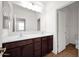 Bathroom features double sinks with wood cabinets and a separate toilet room at 134 E Bernie Ln, Gilbert, AZ 85295