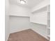 Walk-in closet with carpet, shelving, and ample space for storage of clothing at 134 E Bernie Ln, Gilbert, AZ 85295