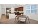Open kitchen with island, stainless appliances, and dining nook featuring a chandelier at 134 E Bernie Ln, Gilbert, AZ 85295