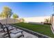 This backyard has artificial turf, a seating area and a stone and gravel perimeter at 1367 S Country Club Dr # 1039, Mesa, AZ 85210