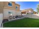 This backyard has artificial turf, a seating area and a stone and gravel perimeter at 1367 S Country Club Dr # 1039, Mesa, AZ 85210