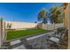 This backyard has artificial turf, a seating area and a stone and gravel perimeter at 1367 S Country Club Dr # 1039, Mesa, AZ 85210