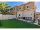 The backyard includes a lush lawn and charming patio area perfect for relaxation and entertaining at 1367 S Country Club Dr # 1039, Mesa, AZ 85210