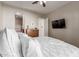 Spacious bedroom featuring a mounted TV, dresser and archway to another room at 1367 S Country Club Dr # 1039, Mesa, AZ 85210