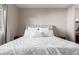 Bright bedroom with a stylish upholstered headboard and comfortable, neutral-toned bedding at 1367 S Country Club Dr # 1039, Mesa, AZ 85210