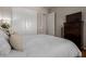 Well-lit bedroom features closet doors, neutral walls, and television on top of dresser at 1367 S Country Club Dr # 1039, Mesa, AZ 85210