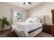 Inviting bedroom with a tufted headboard, plush bedding, and ample natural light at 1367 S Country Club Dr # 1039, Mesa, AZ 85210