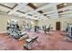 Well-lit community gym with modern exercise equipment and ceiling with trey design at 1367 S Country Club Dr # 1039, Mesa, AZ 85210