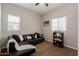 Comfortable living room with a black leather sofa, neutral walls, and window at 1367 S Country Club Dr # 1039, Mesa, AZ 85210