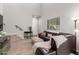 Staged living room offers soaring ceilings, a staircase, and comfortable seating at 1367 S Country Club Dr # 1039, Mesa, AZ 85210