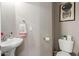 Charming powder room features a pedestal sink, modern fixtures, and tasteful decor at 1367 S Country Club Dr # 1039, Mesa, AZ 85210