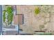 Aerial shot of the property displaying a large, mostly cleared lot with home, driveway, and landscaping at 14415 N 184Th Ave, Surprise, AZ 85388
