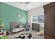 Welcoming bedroom featuring a calming green accent wall at 14415 N 184Th Ave, Surprise, AZ 85388