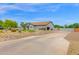 Attractive desert landscaping frames this home with a large, extended driveway at 14415 N 184Th Ave, Surprise, AZ 85388