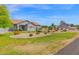Expansive lawn complements the front exterior of this attractive, single-story residential property at 14415 N 184Th Ave, Surprise, AZ 85388