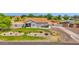 Charming single-story home with landscaped front yard and circular driveway at 14415 N 184Th Ave, Surprise, AZ 85388