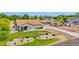 Charming single-story home with landscaped front yard and circular driveway at 14415 N 184Th Ave, Surprise, AZ 85388