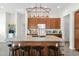 Lovely kitchen features an island with seating and stainless appliances, perfect for entertaining at 14415 N 184Th Ave, Surprise, AZ 85388