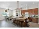 Spacious kitchen with an island featuring bar stool seating and modern stainless appliances at 14415 N 184Th Ave, Surprise, AZ 85388
