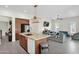 Open layout showcasing a granite island and stainless steel appliances at 14415 N 184Th Ave, Surprise, AZ 85388