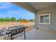 Covered patio featuring built-in grill and expansive outdoor space at 14415 N 184Th Ave, Surprise, AZ 85388