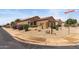 Corner lot with a single-story home featuring desert landscaping and a two-car garage at 16205 W Mountain Pass Dr, Surprise, AZ 85374