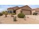 Charming single-story home featuring desert landscaping, a two-car garage, and a cozy, inviting facade at 16205 W Mountain Pass Dr, Surprise, AZ 85374
