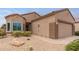 A well maintained single story home with desert landscaping and a two-car garage at 16205 W Mountain Pass Dr, Surprise, AZ 85374