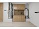 Garage with epoxy flooring, custom cabinets, and a workbench, offering ample storage and a functional workspace at 16205 W Mountain Pass Dr, Surprise, AZ 85374