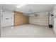 Spacious garage with epoxy flooring and custom cabinets, providing ample storage and organization space at 16205 W Mountain Pass Dr, Surprise, AZ 85374