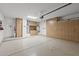 Well-organized garage featuring epoxy flooring and custom wood cabinets, maximizing storage and workspace at 16205 W Mountain Pass Dr, Surprise, AZ 85374