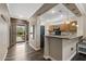 Open-concept kitchen featuring wood floors and an entryway to the front door at 16205 W Mountain Pass Dr, Surprise, AZ 85374