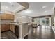 Spacious living room with dark wood floors, sliding glass doors, and a modern, open-concept design at 16205 W Mountain Pass Dr, Surprise, AZ 85374