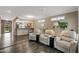 Open-concept living room with neutral tones and comfortable seating at 16205 W Mountain Pass Dr, Surprise, AZ 85374