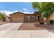 Charming single-story home featuring a stone facade, two-car garage, and well-maintained landscaping at 16987 W Hammond St, Goodyear, AZ 85338