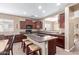 Well-appointed kitchen featuring a granite-topped island with bar seating, stainless appliances and abundant cabinet space at 16987 W Hammond St, Goodyear, AZ 85338