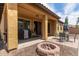 Outdoor patio area with barbecue, table with chairs, and inviting fire pit at 16987 W Hammond St, Goodyear, AZ 85338